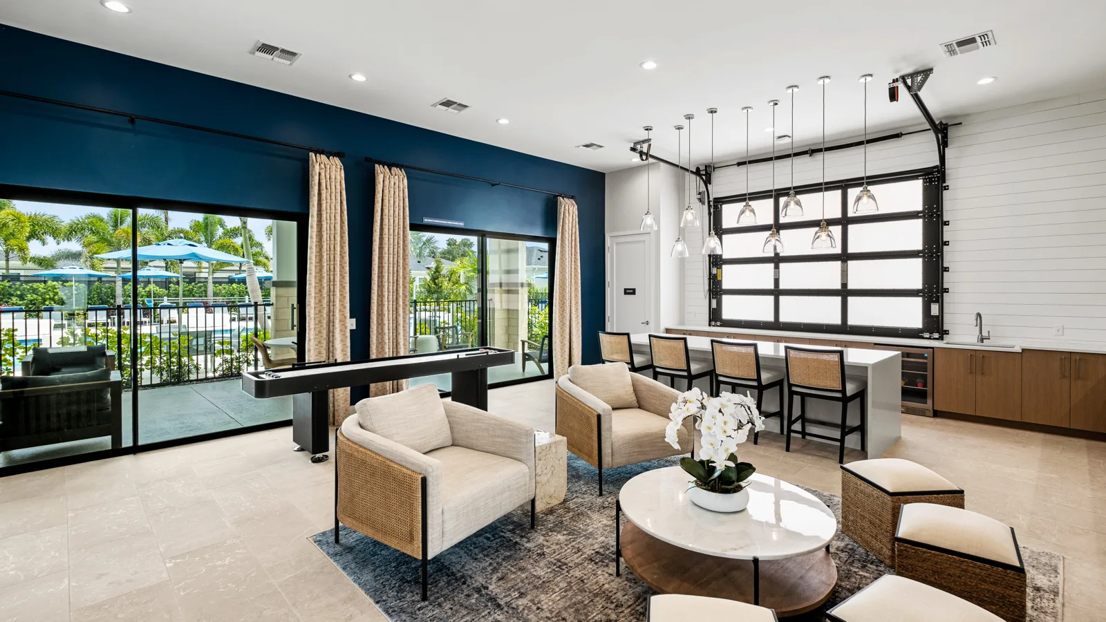 Community clubhouse at Yardly Artisan Lakes in Palmetto, FL. This beautiful community has pet-friendly 1- & 2-bedroom homes with backyards for rent, and also features a pool, onsite gym dog park and pickle ball court.