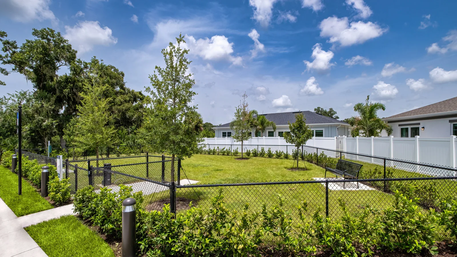 Yardly Artisan Lakes in Palmetto, FL. This beautiful community has pet-friendly 1- & 2-bedroom homes with backyards for rent, and also features a pool, onsite gym dog park, pickle ball court, and community clubhouse.